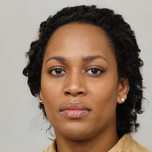 Neutral black young-adult female with long  black hair and brown eyes