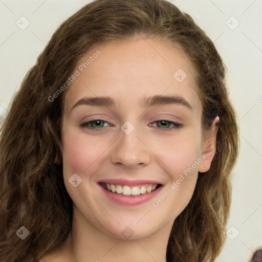 Joyful white young-adult female with long  brown hair and green eyes