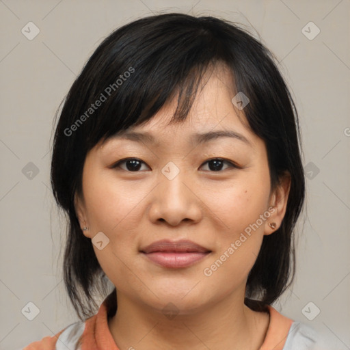 Joyful asian young-adult female with medium  brown hair and brown eyes