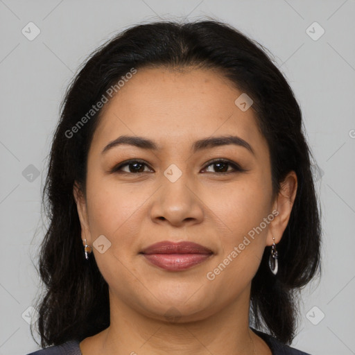 Joyful latino young-adult female with long  brown hair and brown eyes