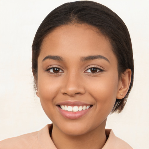 Joyful latino young-adult female with long  brown hair and brown eyes