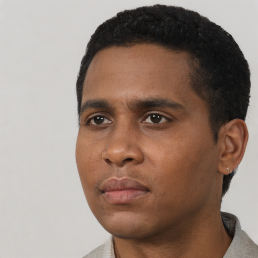 Neutral black young-adult male with short  black hair and brown eyes