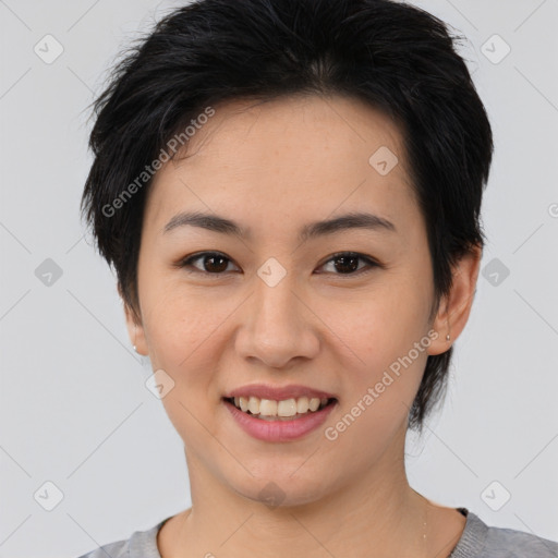 Joyful asian young-adult female with medium  black hair and brown eyes