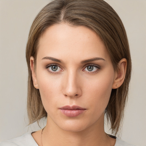 Neutral white young-adult female with medium  brown hair and brown eyes