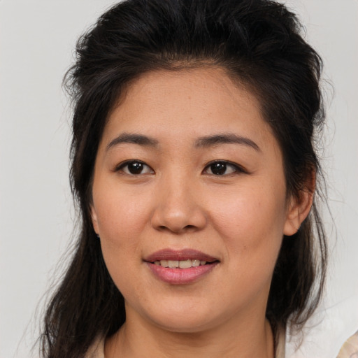 Joyful asian young-adult female with medium  brown hair and brown eyes