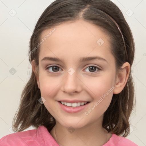 Joyful white child female with long  brown hair and brown eyes