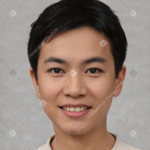 Joyful asian young-adult male with short  black hair and brown eyes