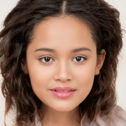 Joyful white child female with long  brown hair and brown eyes