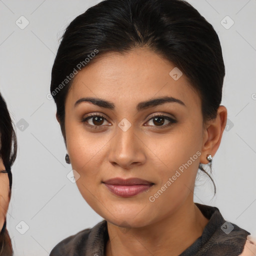 Joyful latino young-adult female with medium  brown hair and brown eyes