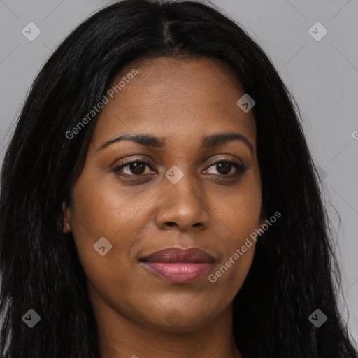 Joyful black young-adult female with long  brown hair and brown eyes