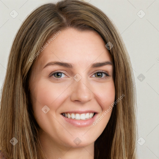 Joyful white young-adult female with long  brown hair and green eyes