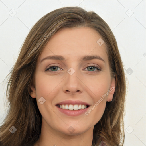 Joyful white young-adult female with long  brown hair and green eyes