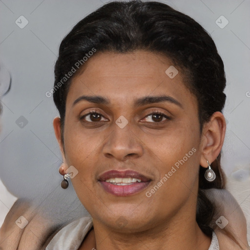 Joyful black adult female with short  brown hair and brown eyes