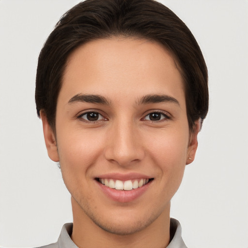 Joyful white young-adult female with short  brown hair and brown eyes