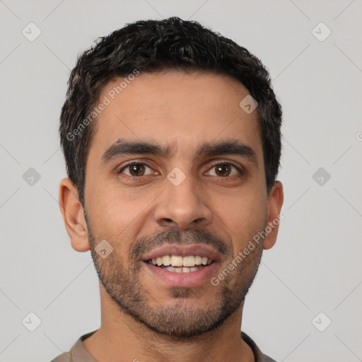 Joyful latino young-adult male with short  black hair and brown eyes