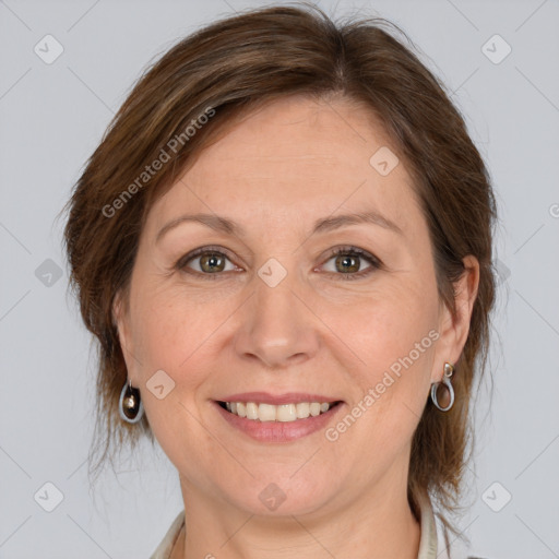 Joyful white adult female with medium  brown hair and grey eyes