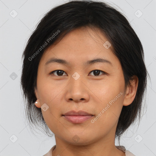 Joyful asian young-adult female with medium  brown hair and brown eyes