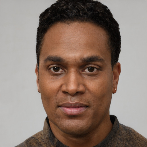 Neutral black adult male with short  black hair and brown eyes