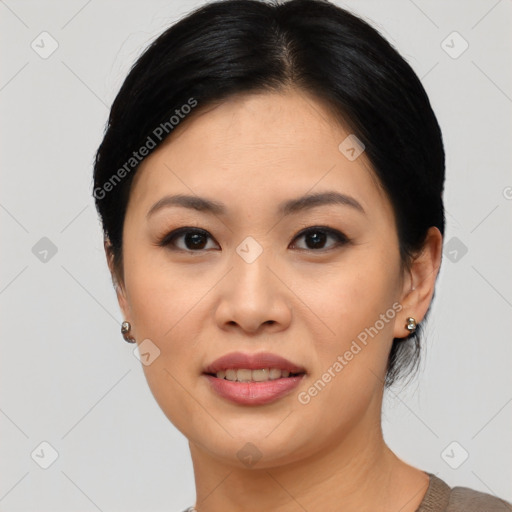 Joyful asian young-adult female with medium  black hair and brown eyes