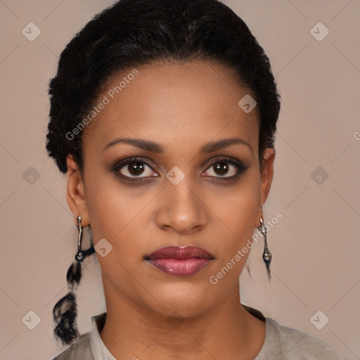 Joyful black young-adult female with short  black hair and brown eyes