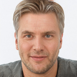 Joyful white adult male with short  brown hair and grey eyes