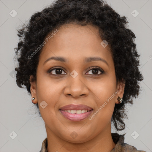 Joyful black young-adult female with long  brown hair and brown eyes