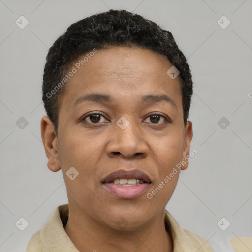 Joyful black adult female with short  brown hair and brown eyes