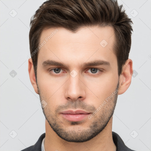 Neutral white young-adult male with short  brown hair and brown eyes