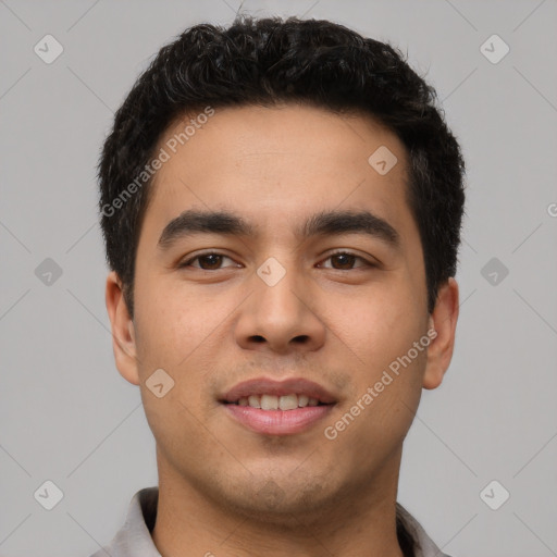 Joyful white young-adult male with short  black hair and brown eyes