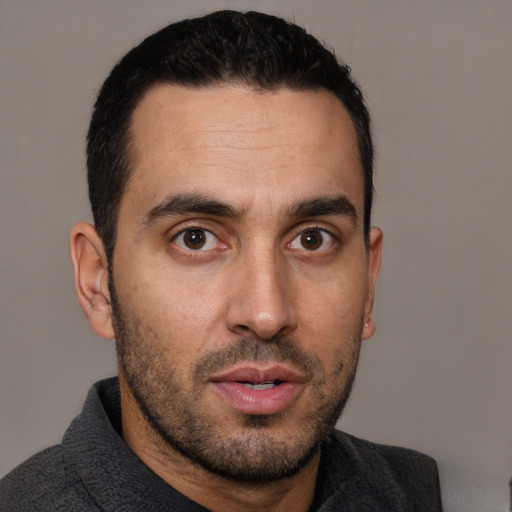 Neutral white young-adult male with short  black hair and brown eyes