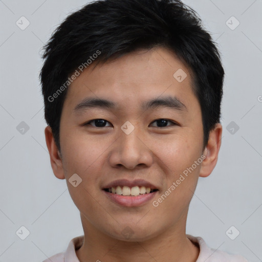 Joyful asian young-adult male with short  black hair and brown eyes