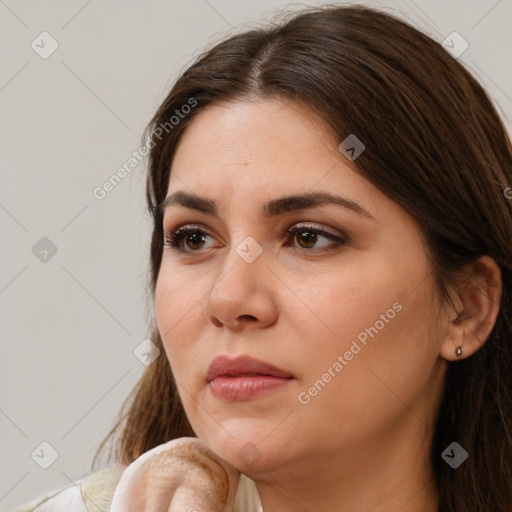 Neutral white young-adult female with long  brown hair and brown eyes