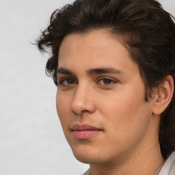 Joyful white young-adult male with medium  brown hair and brown eyes