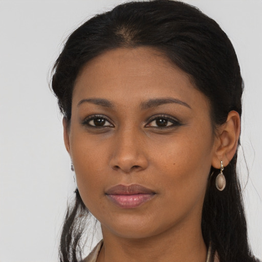 Neutral black young-adult female with long  brown hair and brown eyes