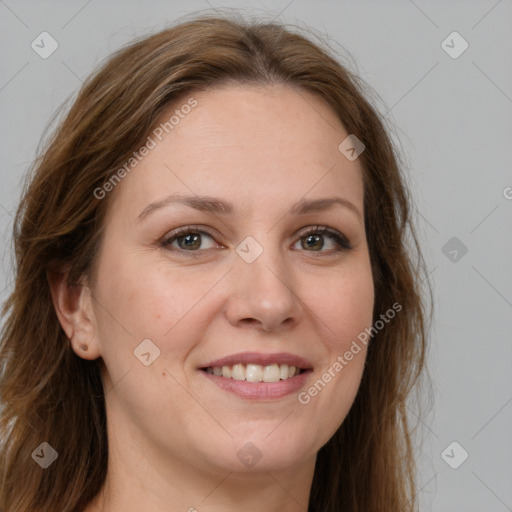 Joyful white adult female with long  brown hair and brown eyes