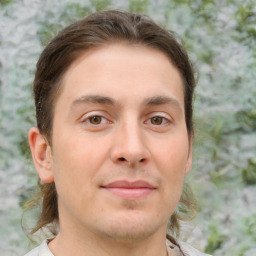 Joyful white young-adult male with medium  brown hair and brown eyes