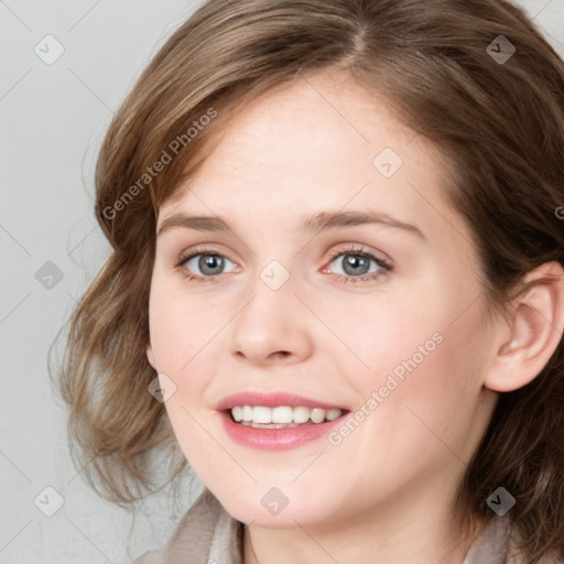 Joyful white young-adult female with medium  brown hair and blue eyes