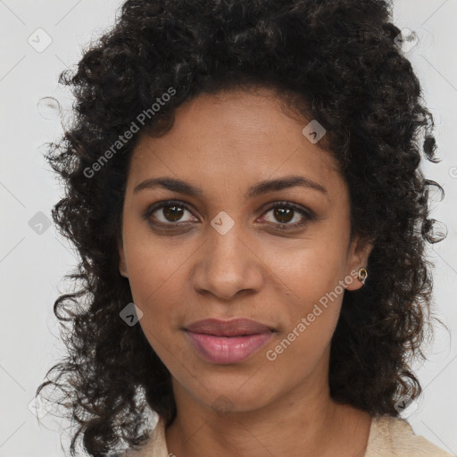 Joyful black young-adult female with long  brown hair and brown eyes