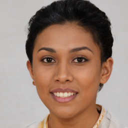 Joyful latino young-adult female with short  brown hair and brown eyes