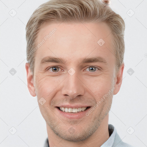 Joyful white young-adult male with short  brown hair and grey eyes