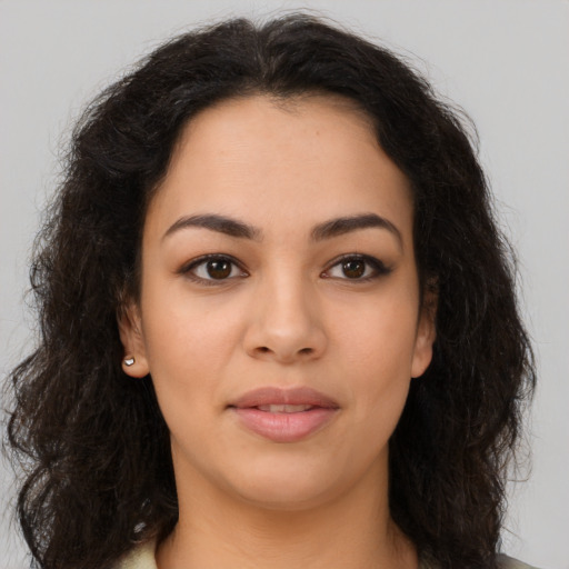 Neutral latino young-adult female with long  brown hair and brown eyes
