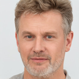 Joyful white adult male with short  brown hair and grey eyes