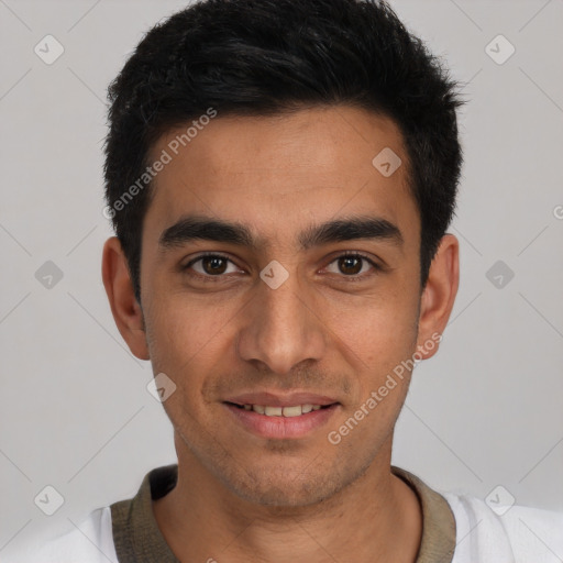 Joyful white young-adult male with short  black hair and brown eyes