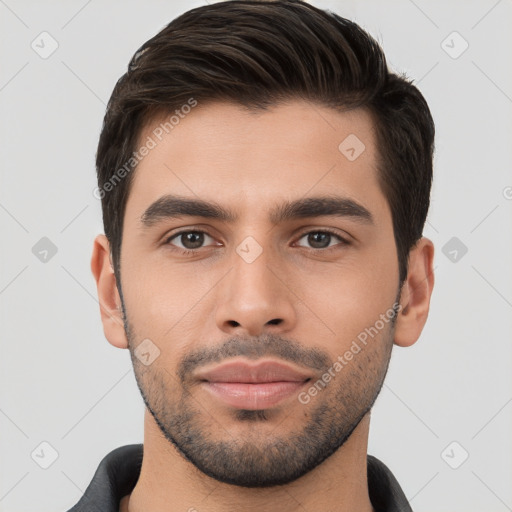 Joyful white young-adult male with short  brown hair and brown eyes