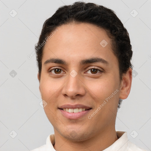 Joyful white young-adult male with short  brown hair and brown eyes