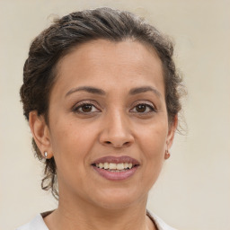 Joyful white adult female with short  brown hair and brown eyes