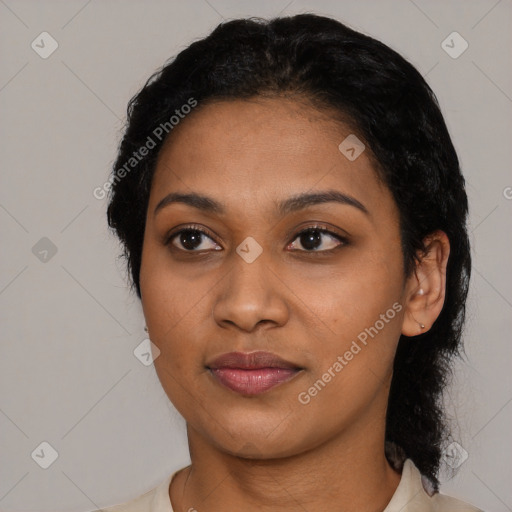 Joyful black young-adult female with short  black hair and brown eyes
