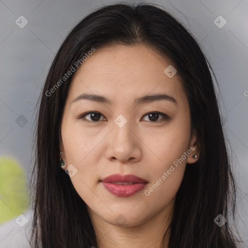 Joyful asian young-adult female with long  brown hair and brown eyes