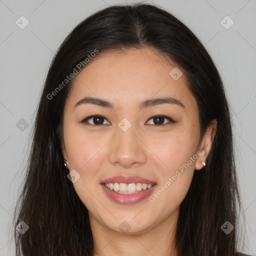 Joyful asian young-adult female with long  brown hair and brown eyes