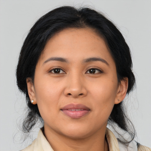 Joyful asian young-adult female with medium  black hair and brown eyes